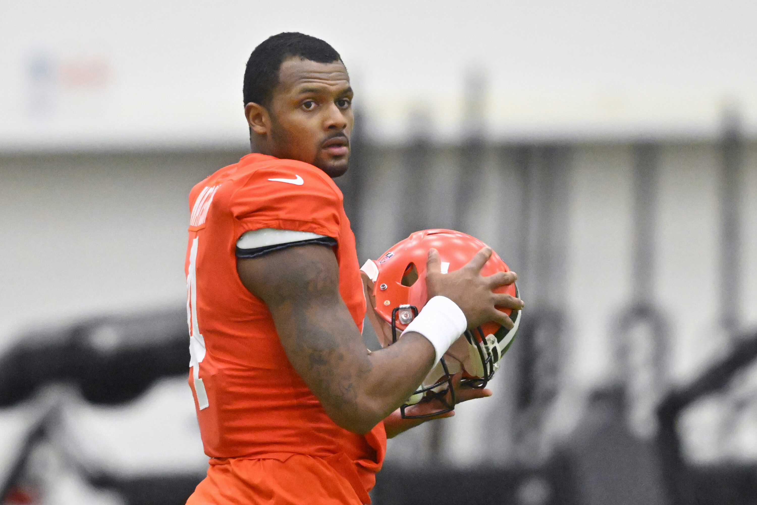 Cleveland Browns quarterback Deshaun Watson stands on the field during an NFL football practice at the team's training facility Wednesday, Nov. 30, 2022, in Berea, Ohio.