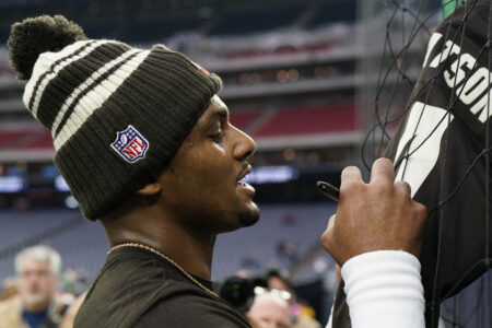 Cleveland Browns quarterback Deshaun Watson signs autographs before of an NFL football game between the Cleveland Browns and Houston Texans in Houston, Sunday, Dec. 4, 2022.
