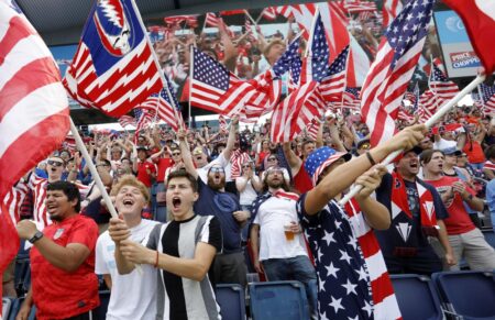 United States soccer fans celebrate before a CONCACAF Gold Cup soccer match against Canada in Kansas City, Kan., Sunday, July 18, 2021.