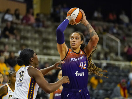 FILE - Phoenix Mercury center Brittney Griner (42) shoots over Indiana Fever forward Teaira McCowan (15) in the first half of a WNBA basketball game in Indianapolis, Monday, Sept. 6, 2021. The United States stepped up its push Friday, March 18, 2022, for consular access to Brittney Griner, the WNBA star who is detained in Russia on allegations of drug smuggling, as a member of a Russian state-backed prison monitoring group said Griner was faring well behind bars. (AP Photo/Michael Conroy, File)