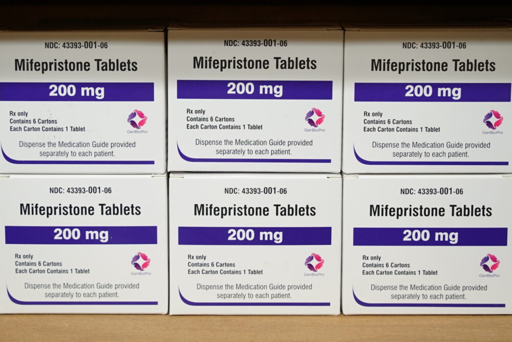 FILE - Boxes of the drug mifepristone sit on a shelf at the West Alabama Women's Center in Tuscaloosa, Ala., on March 16, 2022. On Tuesday, Jan. 3, 2023, the Food and Drug Administration finalized a rule change that allows women seeking abortion pills to get them through the mail, replacing a long-standing requirement that they pick up the medicine in person. 