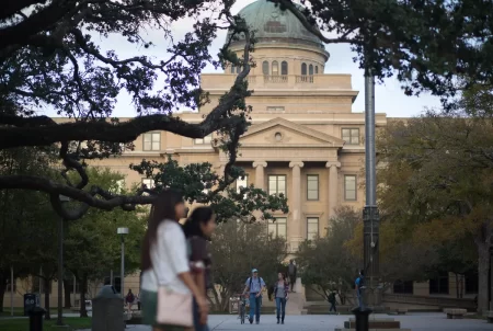 Students walk around the Texas A&M University campus in College Station.