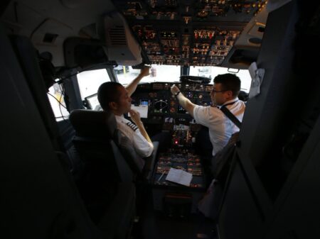 A Southwest Airlines pilot and co-pilot preparing for a flight from Dallas last year. In the wake of the Germanwings crash this week, many European airlines are rushing to adopt a two-person cockpit rule similar to the one already in place in the U.S.