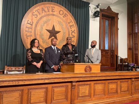 State Rep. Jolanda Jones, D-Houston (third from left) speaks to reporters Wednesday about a bill she authored that would require police officers to have a liability insurance policy in order to work in the state.
