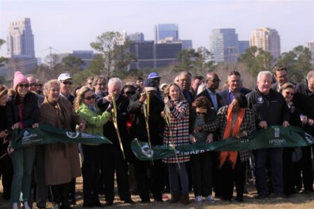 Officials cut the ribbon for the Memorial Park Land Bridge opening.