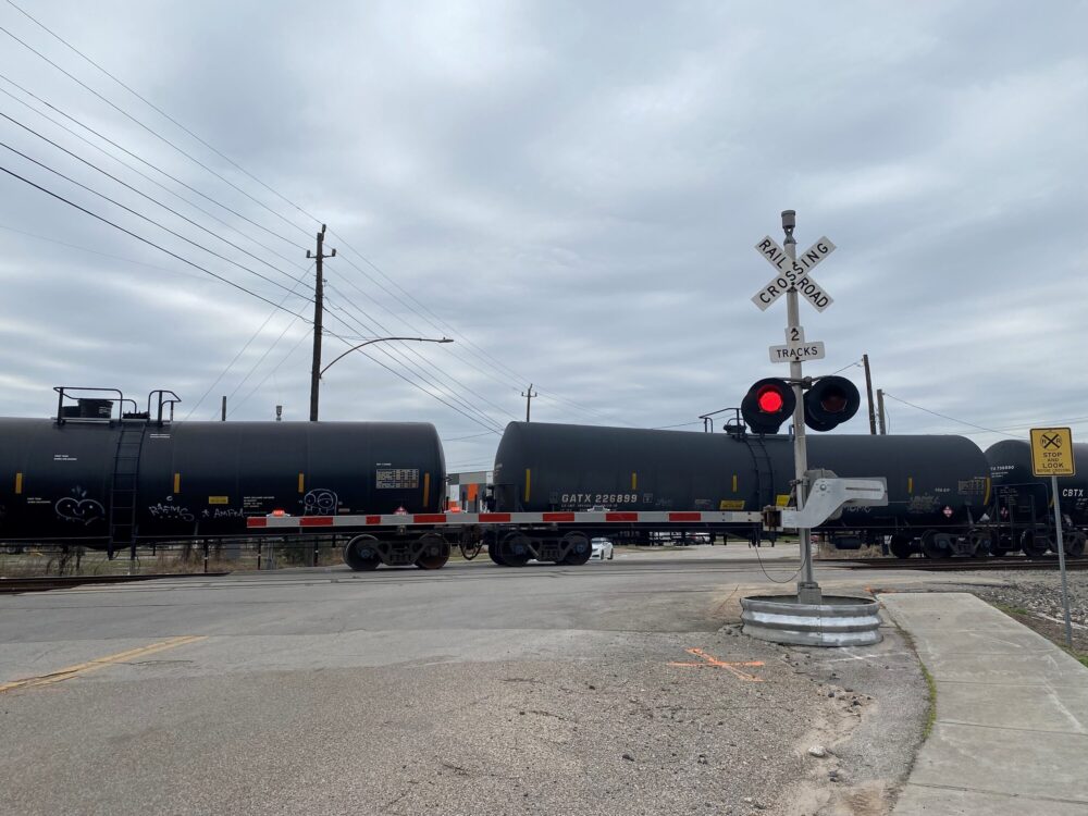 A freight train is stopped at a crossing in Houston’s East End. Trains in the neighborhood have stopped for up to eight hours, according to a neighborhood-funded security camera.