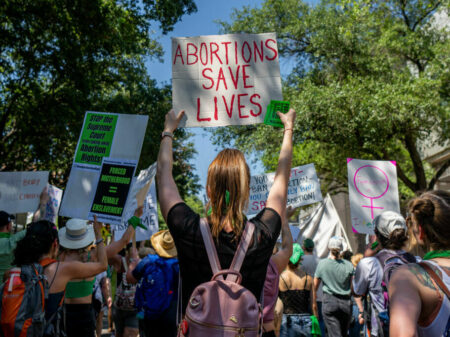 AUSTIN, TEXAS - MAY 14: Abortion rights activists and supporters march outside of the Austin Convention Center where the American Freedom Tour with former President Donald Trump is being held on May 14, 2022 in Austin, Texas. Abortion rights supporters marched and protested outside Trump's American Freedom Tour in response to the Supreme Court's leaked draft opinion indicating the Court could overturn Roe v. Wade. (Photo by Brandon Bell/Getty Images)