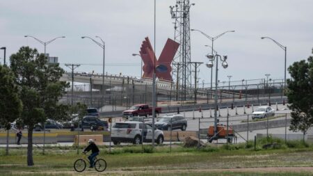 A small line of cars waits to cross the Cordova Bridge of the Americas at the United States-Mexico border, which was closed to non-essential traffic in efforts to control the corona virus, COVID-19, outbreak in El Paso, Texas on March 21, 2020. - US President Donald Trump announced on March 20, 2020, that the US and Mexico have agreed to restrict non-essential travel across their border beginning on March 21. The shutdown appears to only affect tourists and shoppers, but has created confusion amongst residents as to whether or not they can cross. (Photo by Paul Ratje / Agence France-Presse / AFP) (Photo by PAUL RATJE/Agence France-Presse/AFP via Getty Images)