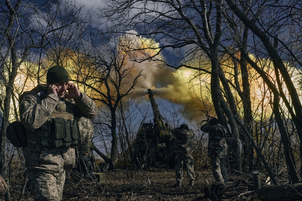 Ukrainian soldiers fire a self-propelled howitzer towards Russian positions near Bakhmut, Donetsk region, Ukraine, Sunday, March 5, 2023.