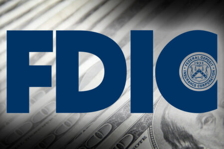The FDIC Logo on background of one hundred dollar bills