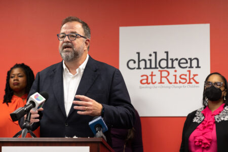 Children at Risk President and CEO Bob Sanborn unveils the nonprofit's latest Growing Up In Houston report on March 28, 2023.