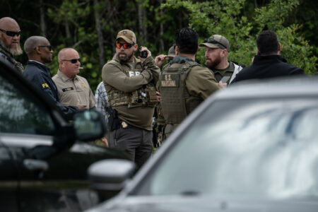 CLEVELAND, TX - APRIL 29: Law enforcement search for the suspect a few miles from the scene where five people, including an 8-year-old child, were killed after a shooting inside a home on April 29, 2023 in Cleveland, Texas. The alleged gunman, who is not yet in custody, used an AR-15-style rifle to shoot his neighbors which also left at least three others injured. (Photo by Go Nakamura/Getty Images)