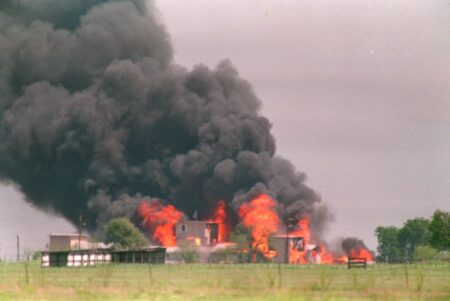 FILE - In this April 19, 1993 file photo, flames engulf the Branch Davidian compound in Waco, Texas. Doomsday cult leader David Koresh's apocalyptic vision came true when the fire believed set by his followers destroyed their prairie compound as federal agents tried to drive them out with tear gas after a 51-day standoff. As many as 86 members of the Branch Davidian religious sect, including Koresh and 24 children, were thought to have died as the flames raced through the wooden buildings in 30 minutes. Only nine were known to have survived.