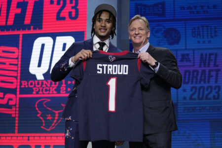 Ohio State quarterback C.J. Stroud, left, poses beside NFL Commissioner Roger Goodell after being chosen by the Houston Texans with the second overall pick during the first round of the NFL football draft, Thursday, April 27, 2023, in Kansas City, Mo.