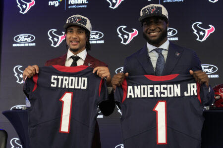 Houston Texans first round draft picks quarterback C.J. Stroud, left, and linebacker Will Anderson Jr. hold up jerseys during an introductory NFL football press conference