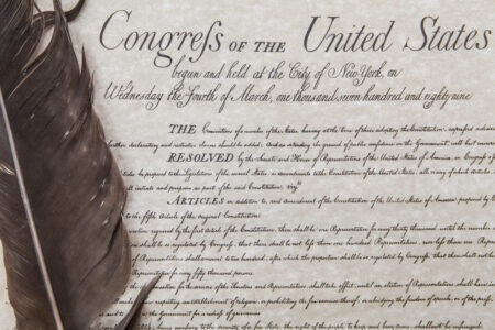 Close crop of the United State's Bill of Rights with an eagle feather pen.