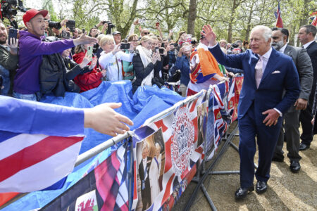 Britain's King Charles III greets well-wishers outside Buckingham Palace, in London, Friday, May 5, 2023 a day before his coronation takes place at Westminster Abbey. (Toby Melville, Pool via AP)