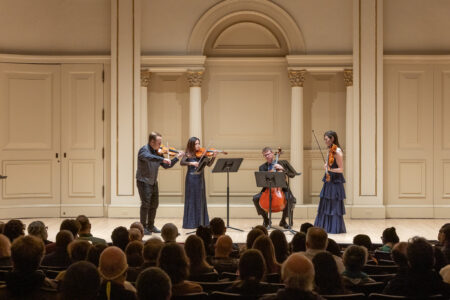Photo of string quartet performing on stage at Carnegie Hall