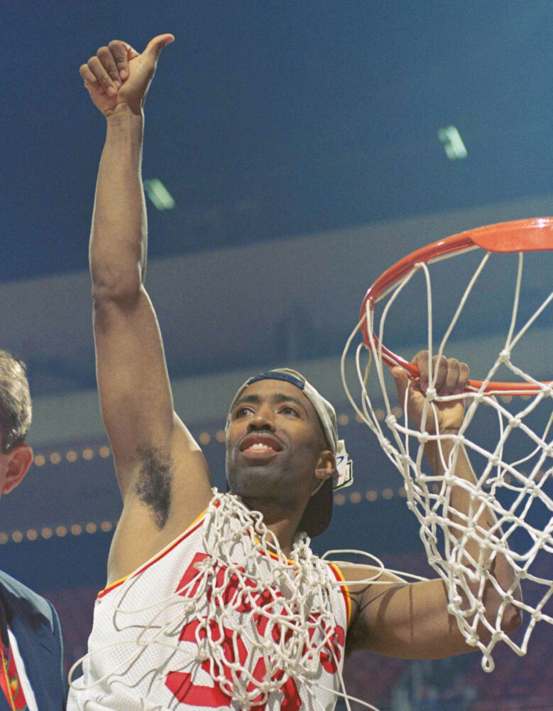 Houston Rockets guard Kenny Smith celebrates after his team swept the Orlando Magic to win their second straight NBA championship in 1995.