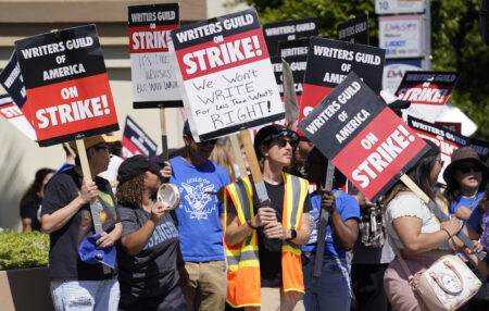 Striking writers take part in a rally in front of Paramount Pictures studio, Wednesday, May 17, 2023, in Los Angeles.