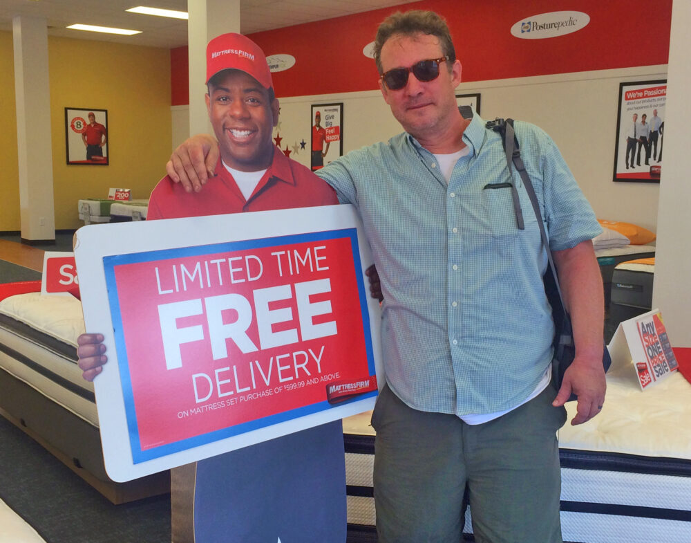 Writer John Nova Lomax poses inside a Mattress Firm store at the corner of Westheimer and Montrose in 2015.