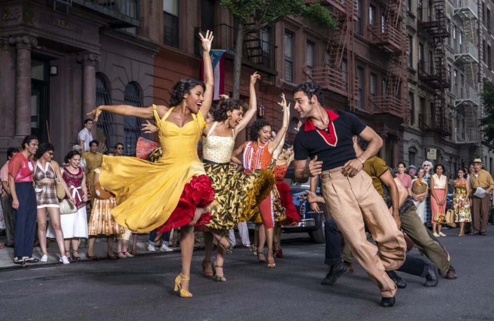People dancing in a street in a scene from the 2021 remake of West Side Story