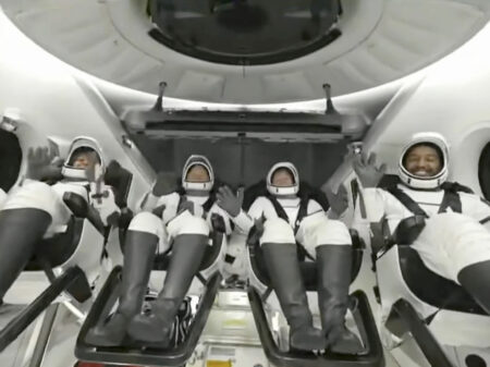 In this image taken from video broadcast by SpaceX, crew members wave after the SpaceX Dragon capsule splashed down into the Gulf of Mexico, just off the Florida Panhandle, late Tuesday, May 30, 2023. The private flight carrying two Saudi astronauts and other passengers returned to Earth after a nine-day trip to the International Space Station. (SpaceX via AP)
