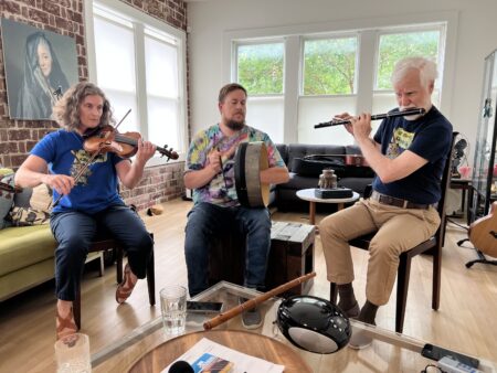 Musicians perform traditional Irish music in a Houston home.