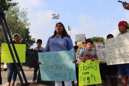 Jessica Campos stands with protesters to oppose TEA's takeover of HISD.