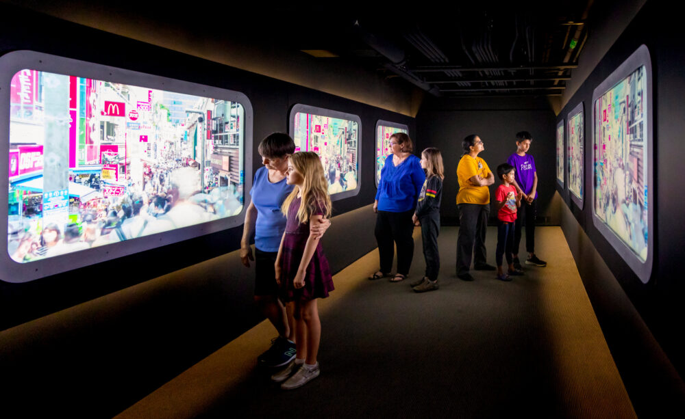 Inside a virtual bullet train in the Explore Asia exhibit.