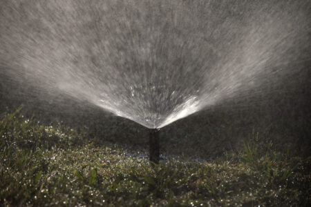 FILE - A sprinkler waters the lawn of a home on Wednesday, May 18, 2016, in Santa Ana, Calif. T On Tuesday, Dec. 13, 2022, the Metropolitan Water District declared a regional drought emergency for all of Southern California.