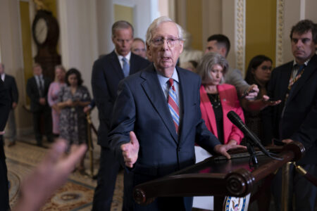 Senate Minority Leader Mitch McConnell, R-Ky., center, returns to his press conference after the 81-year-old GOP leader froze at the microphones and became disoriented, at the Capitol in Washington, Wednesday, July 26, 2023. McConnell went to his office for a few minutes and returned to finish speaking with reporters.