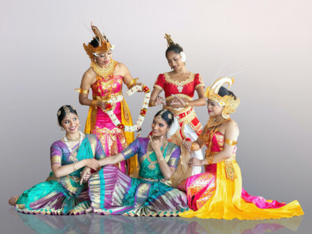 Photo of dancers in colorful South Asian clothing