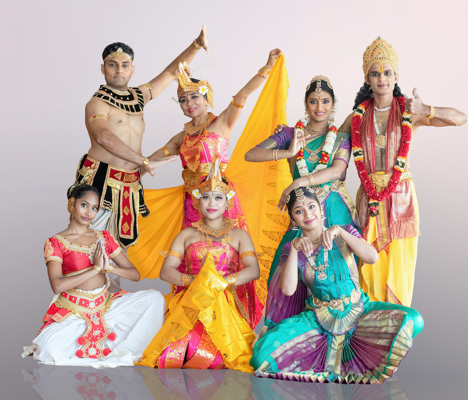 Photo of dancers in colorful South Asian clothing