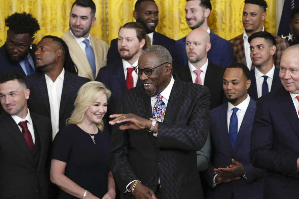 Houston Astros manager Dusty Baker Jr., center, arrives during an event celebrating the 2022 World Series champion Houston Astros baseball team in the East Room of the White House, Monday, Aug. 7, 2023, in Washington. Houston Astros owner Jim Crane looks on at right.
