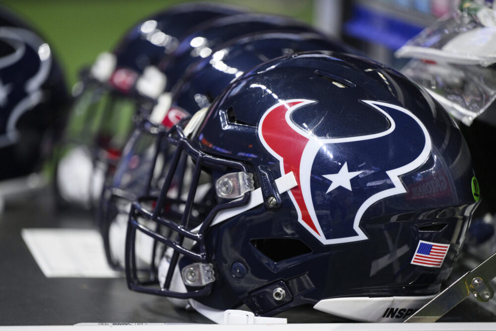 Houston Texans helmets sit on the sidelines before an NFL football game against the Indianapolis Colts, Sunday, Jan. 8, 2023, in Indianapolis. (AP Photo/Zach Bolinger)