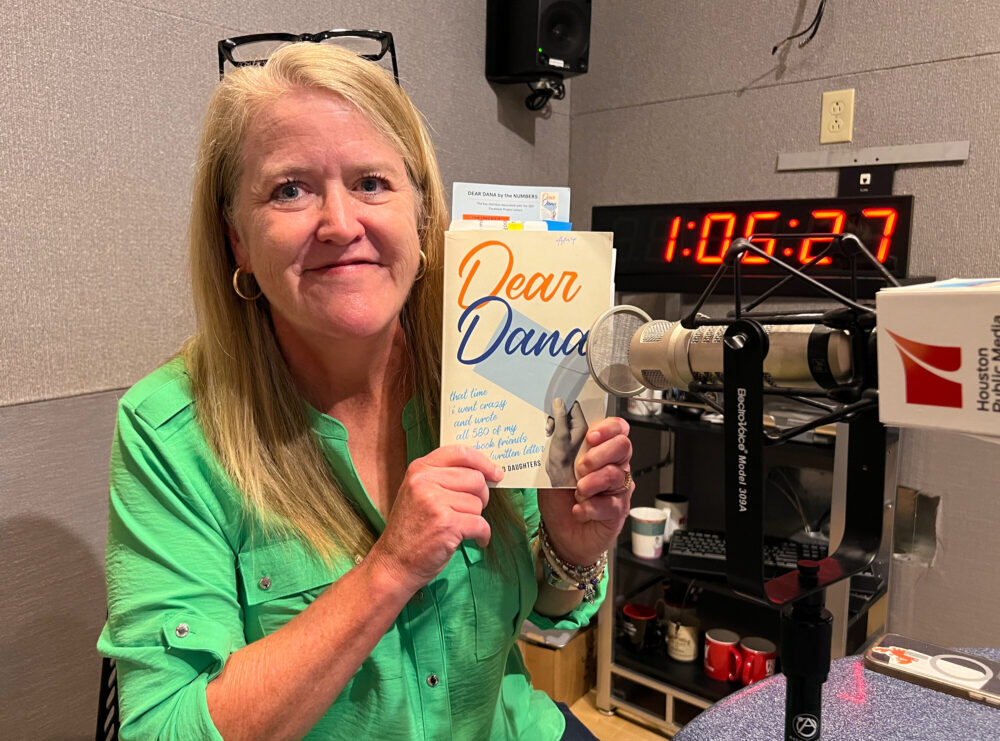 Amy Weinland Daughters holding her book, Dear Dana