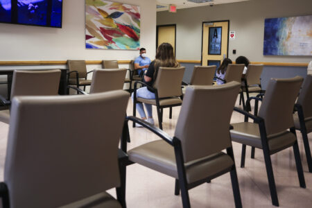 Patients sit in a waiting area for their appointments Friday, July 7, 2023, at LBU Community Clinic.