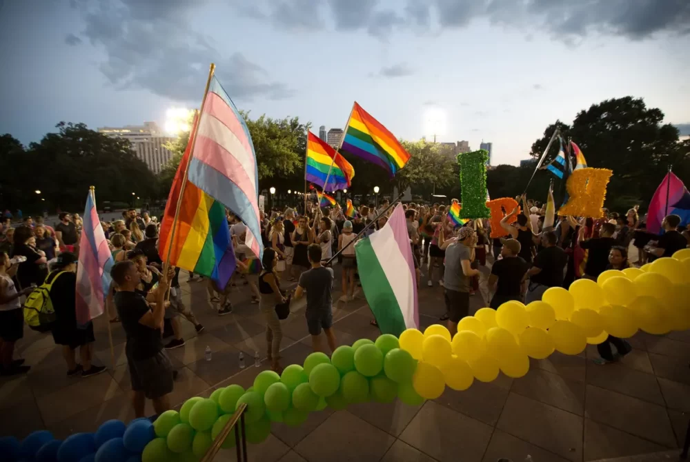 Activists and members of Austin’s LGBTQ+ community gather on the steps of the Texas Capitol in 2017 to commemorate the anniversary of the Stonewall uprising, a key moment in the birth of the modern LGBTQ+ rights movement in America.