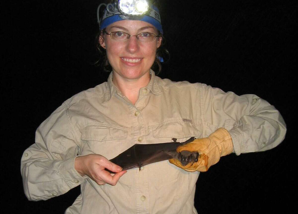 Conservationist Cullen Geiselman holding a bat
