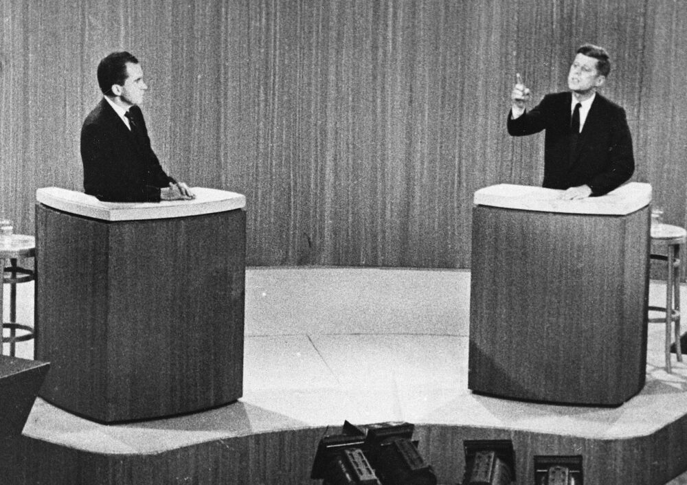 Richard Nixon listens as John F. Kennedy makes a point during a televised presidential debate
