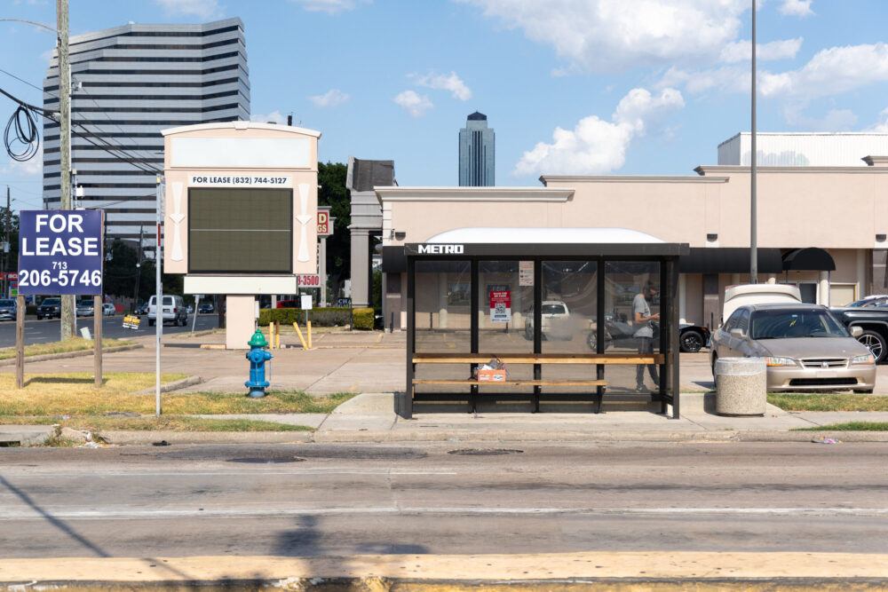 METRO's standard bus shelter design has clear panels on three sides.