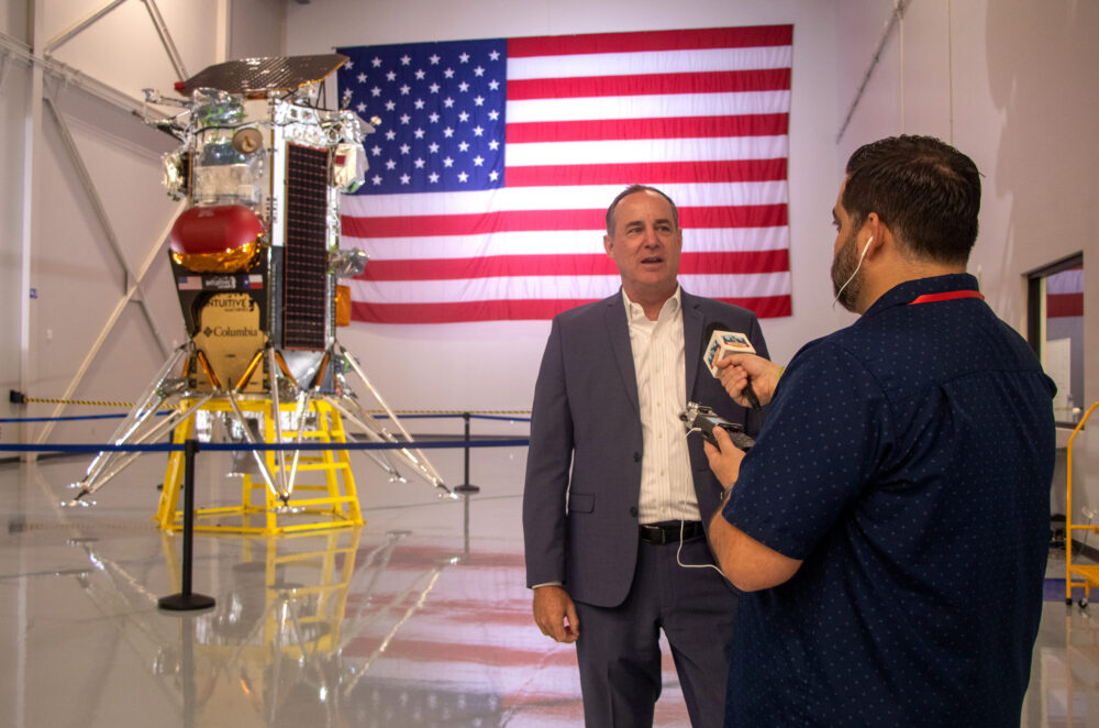 Intuitive Machines CEO Steve Altemus talks with Houston Matters producer Michael Hagerty in front of the Nova-C lunar lander.