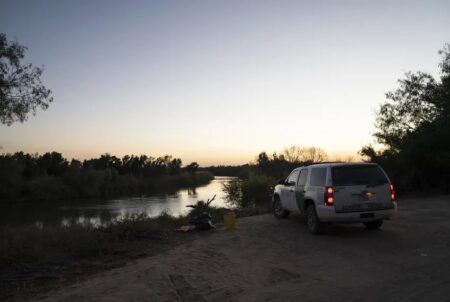 A border patrol vehicle on the banks of the Rio Grande in Rio Grande City.