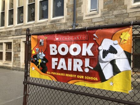 A Scholastic Book Fair banner pictured outside a school in Queens, New York.
