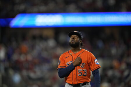 Houston Astros starting pitcher Cristian Javier walks toward the dugout after throwing against the Texas Rangers during the first inning in Game 3 of the baseball American League Championship Series Wednesday, Oct. 18, 2023, in Arlington, Texas. (AP Photo/Julio Cortez)