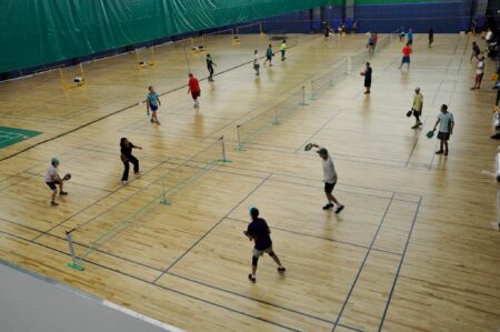 Overhead view of players playing pickleball