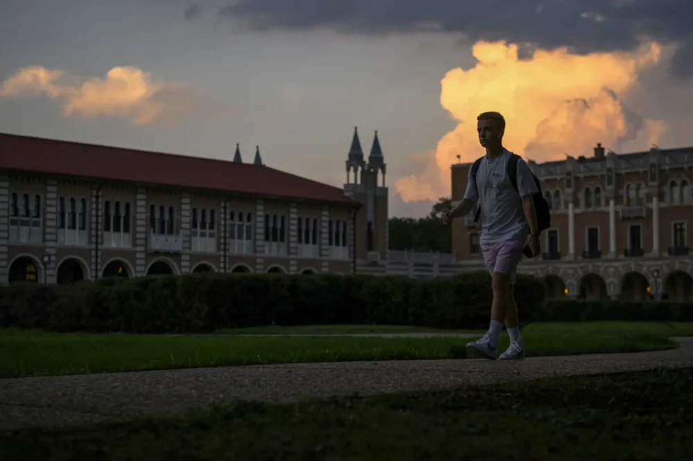 A student walks through campus at Rice University. Credit: Callaghan O'Hare for The Texas Tribune