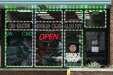 Signs are displayed at a smoke shop in Park Ridge, Ill., Monday, Aug 14, 2023.