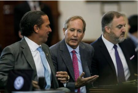 Texas Attorney General Ken Paxton, center, talks with defense attorney Tony Buzbee, left, before closing arguments in his impeachment trial before the Texas Senate on Sept. 15, 2023.